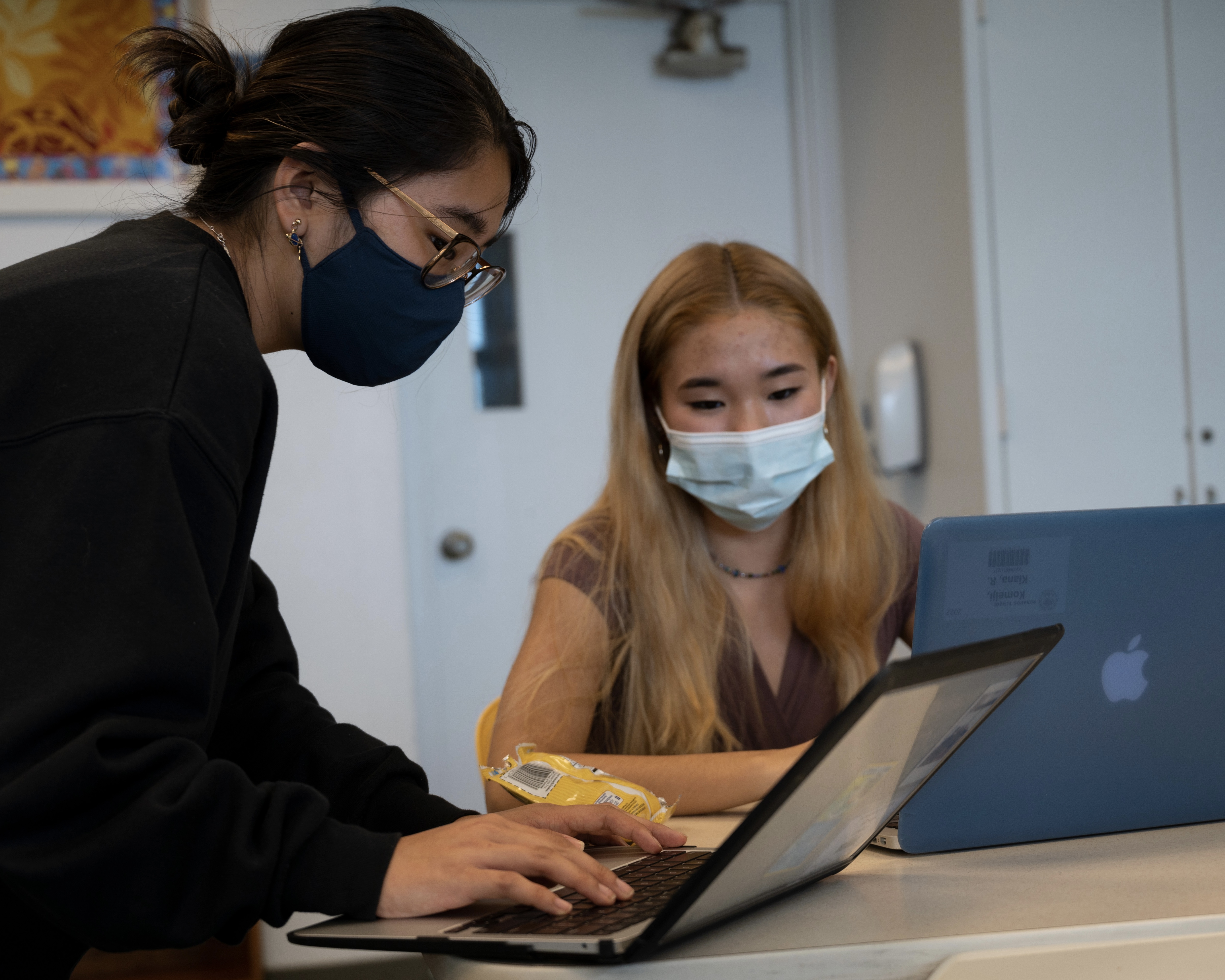 Two Girls working together on Code